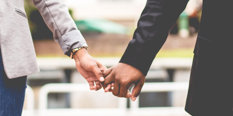 Couple holding hands signifying questions on separation and divorce