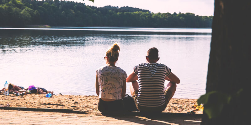 Man and Woman Looking Over Water signifying the lowdown on divorce