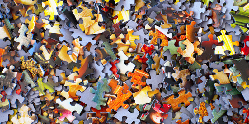 Jigsaw pieces scattered symbolising mediation