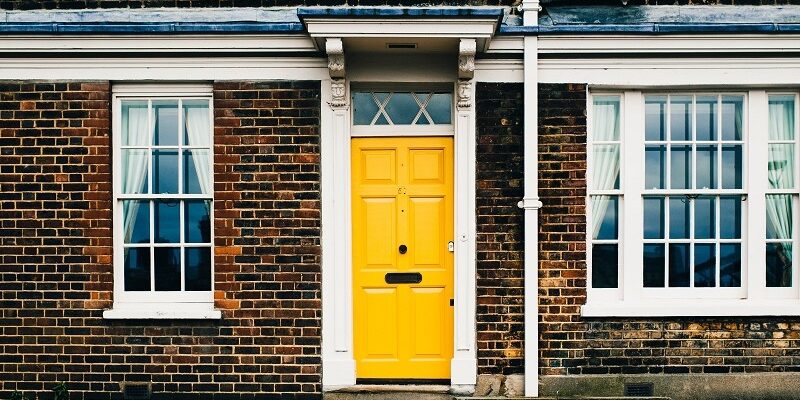 Yellow door of Brick Property