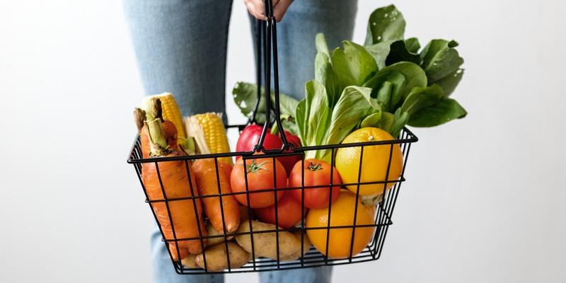 Shopping Basket of Fresh Vegetables and Fruit signifying vegan and veganism