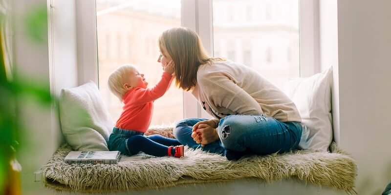 Child Touching Mothers Face signifying domestic staff