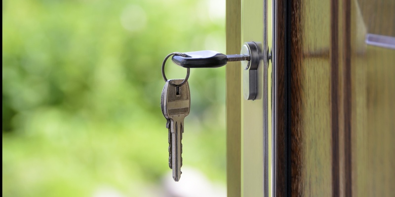 Keys in a door signifying property purchase