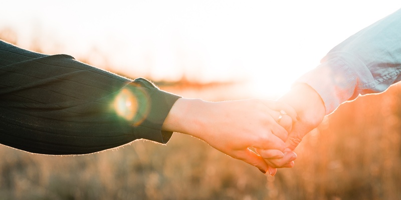 Couple holding hands signifying wills and inheritance