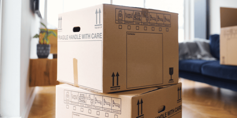 Apartment with two packing boxes in foreground, indicating moving home or property from a relationship break-up unmarried and separating, what to do about your property