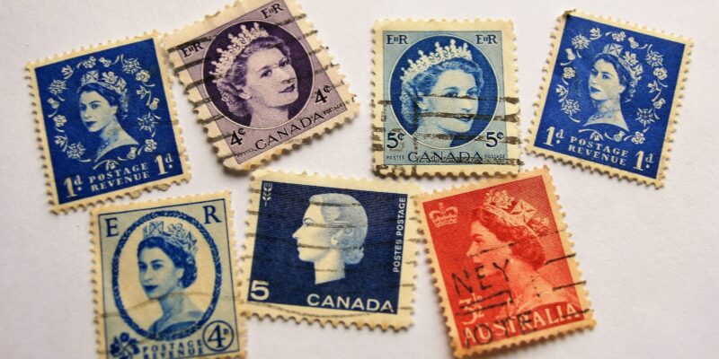 Collection of franked, vintage commonwealth stamps featuring the head of Queen Elizabeth II to signify whether the Queen will pay inheritance tax.